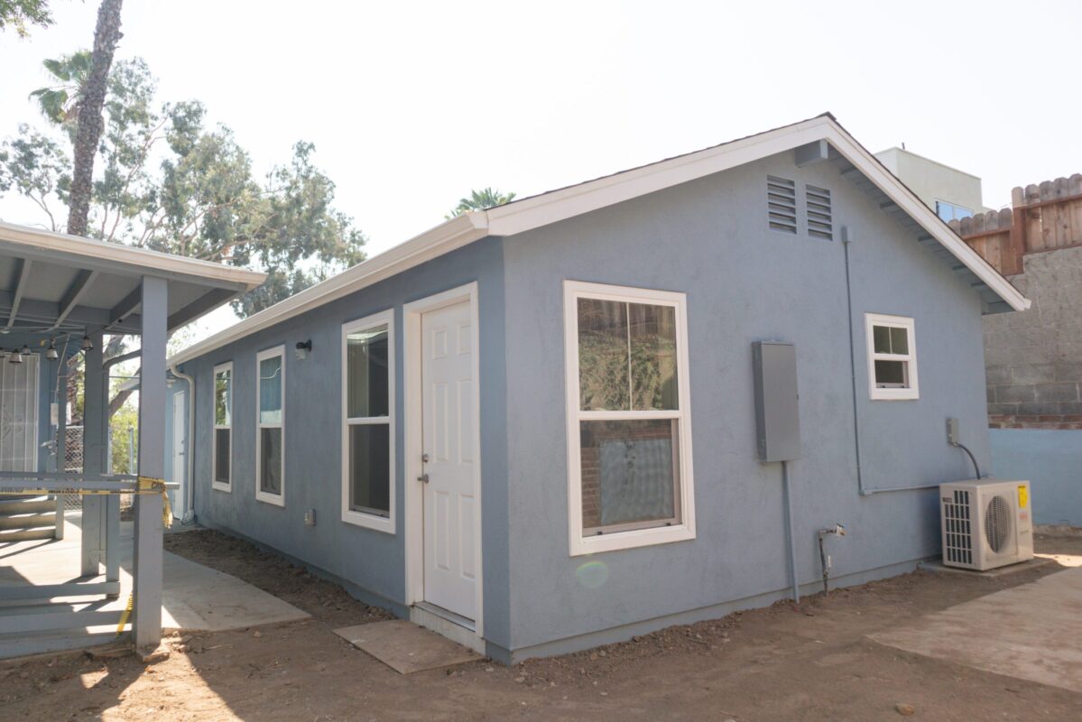 an ADU unit with blue paint and white door in Pasadena