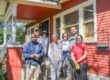 photo of volunteer group with homeowner for home repair
