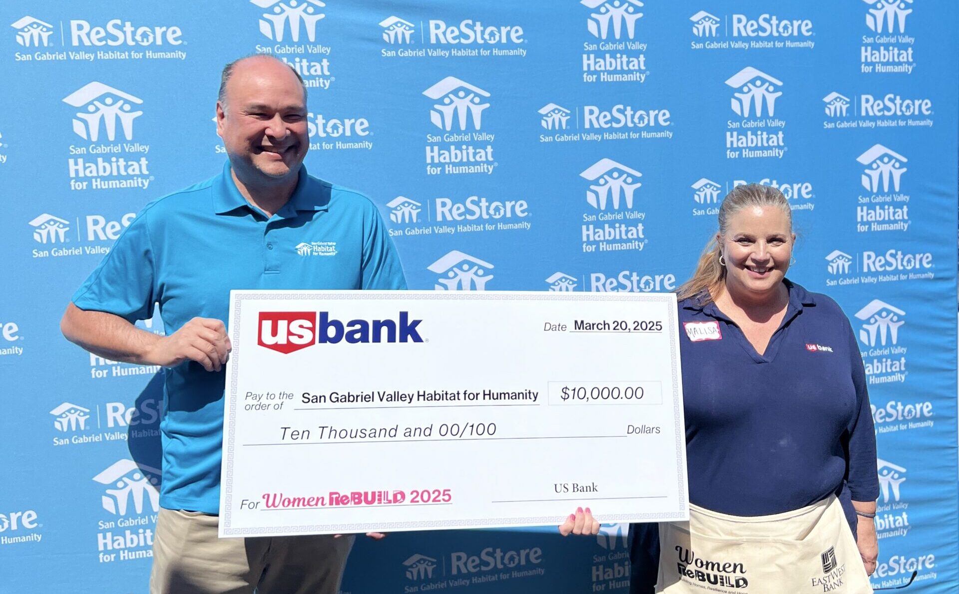 Check presentation with CEO Bryan Wong and board member Malisa Day during US Bank Build Day for women build 2025