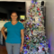 woman standing in front of a christmas tree