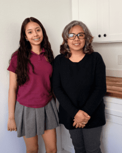 mother daughter standing together