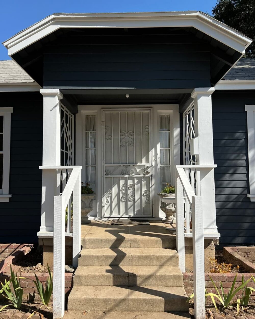 Painted and clean front porch with dark blue paint
