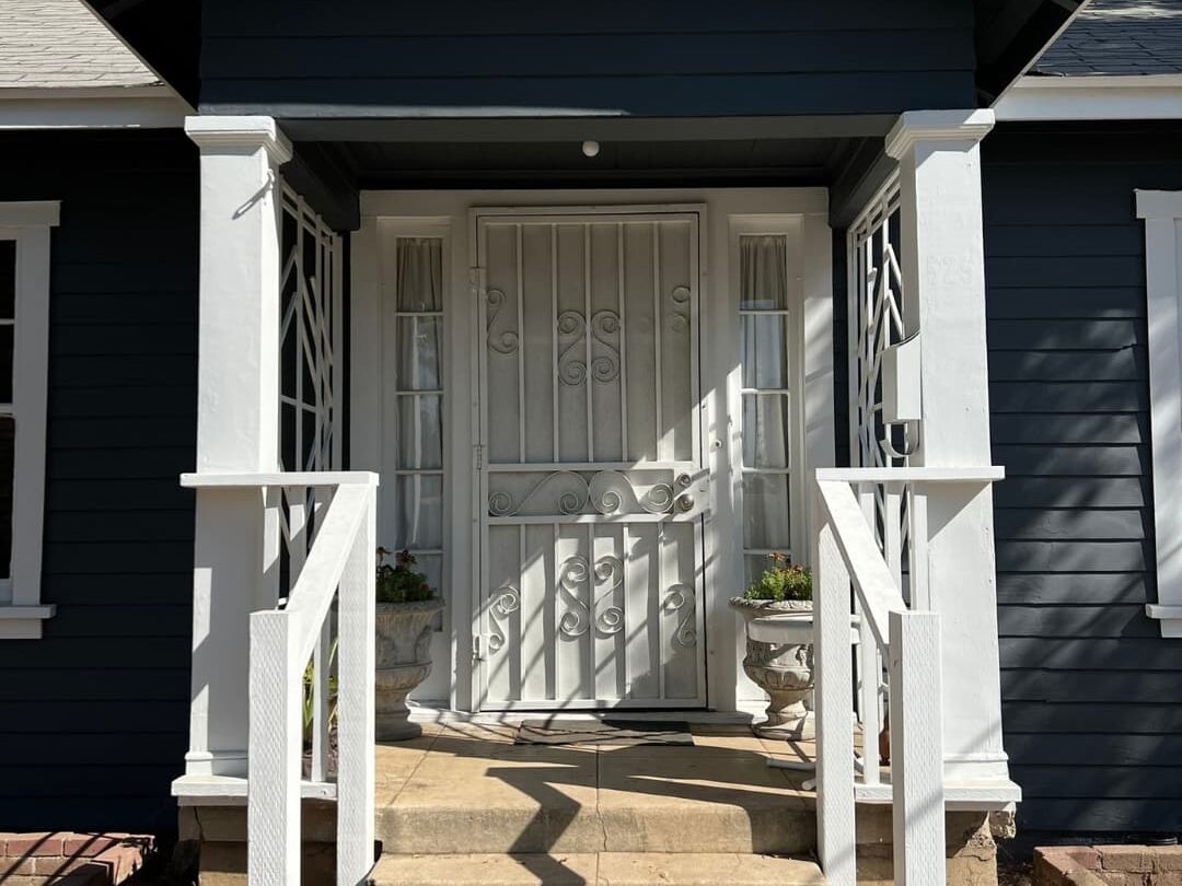 Painted and clean front porch with dark blue paint