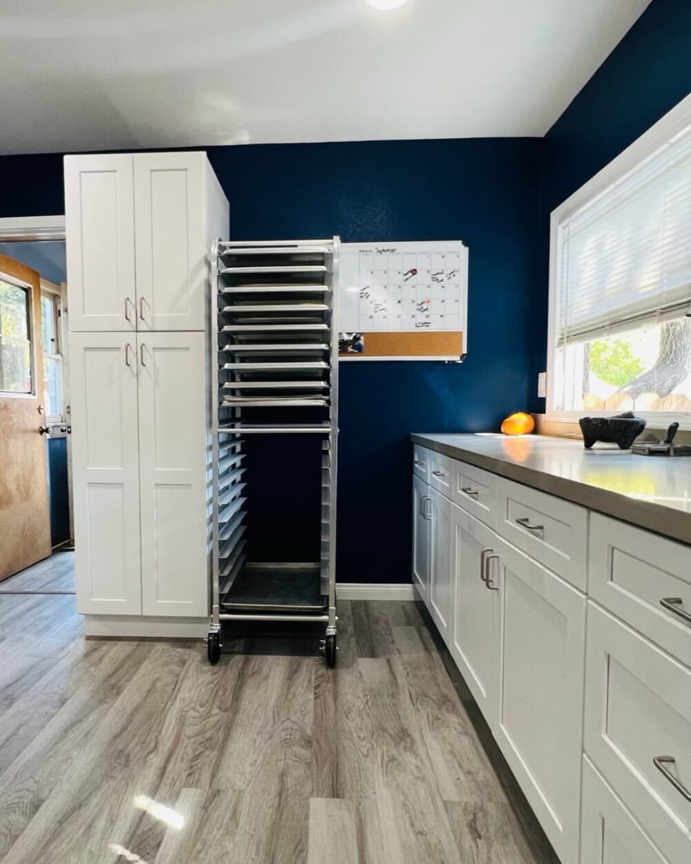 Newly painted kitchen with new counter tops and white cabinets