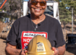 homeowner posing with gold hard hat