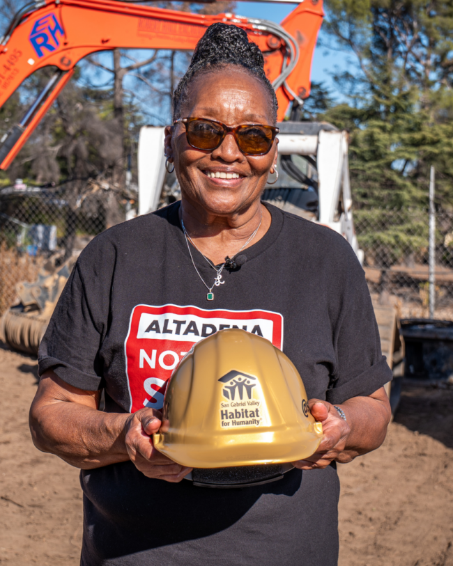 Louise – Mcnalley (2) homeowner posing with gold hard hat