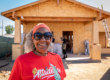 homeowner standing in front of house under construction