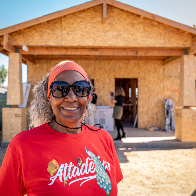 homeowner standing in front of house under construction