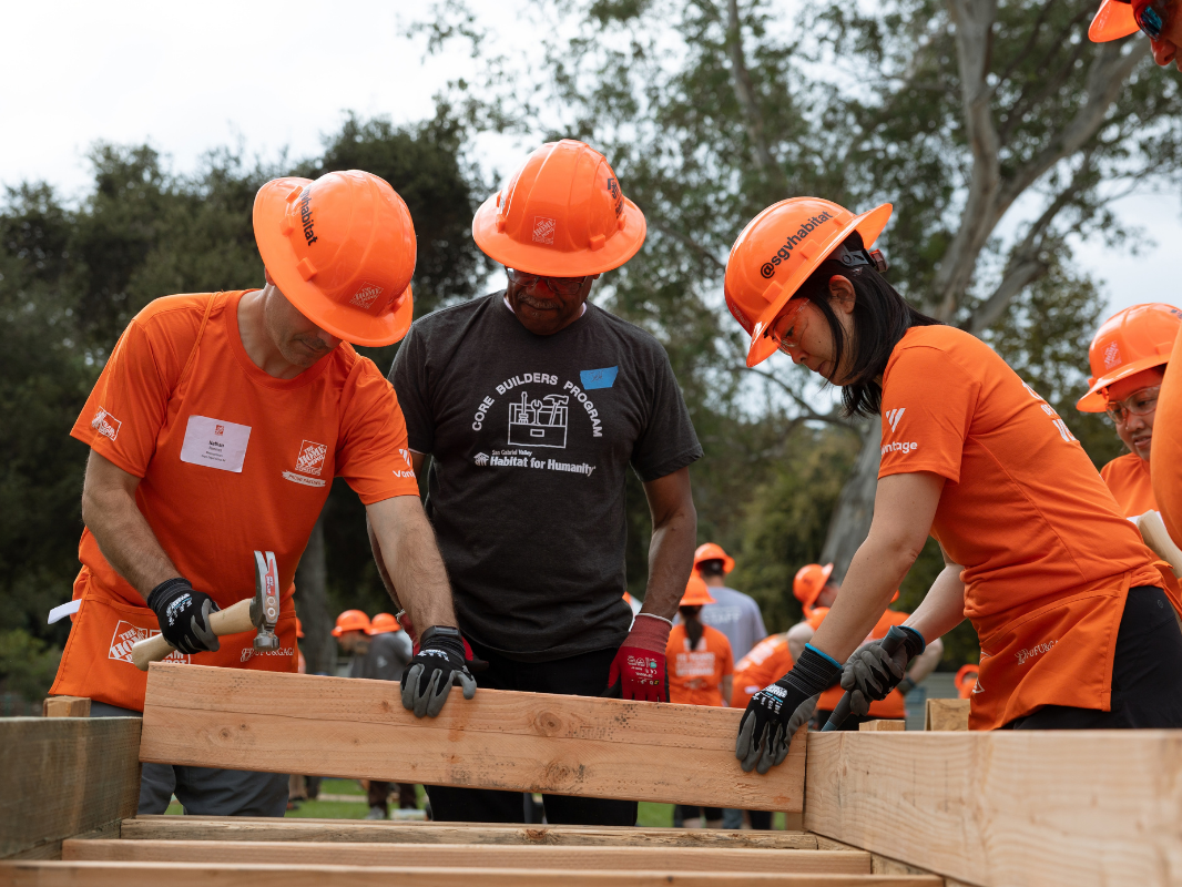 volunteers building a wall