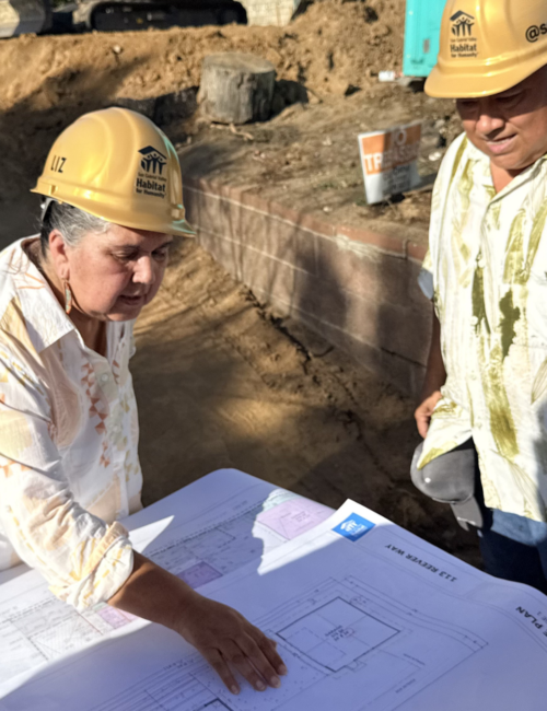 couple looking over building plans