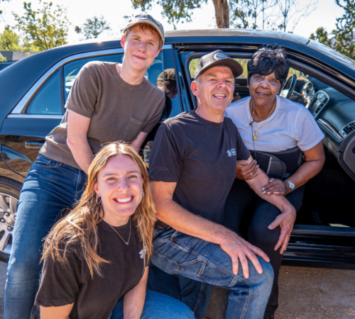 4 people smiling