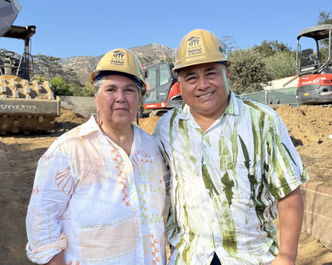 roque and liz couple standing on their empty lot