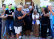 group of people celebrating a ribbon cutting