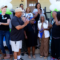 group of people celebrating a ribbon cutting