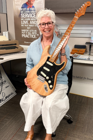 Raffle Winner Holding Fender Guitar