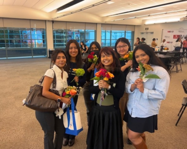 2026 PCC Fellowship Students students posing with flowers
