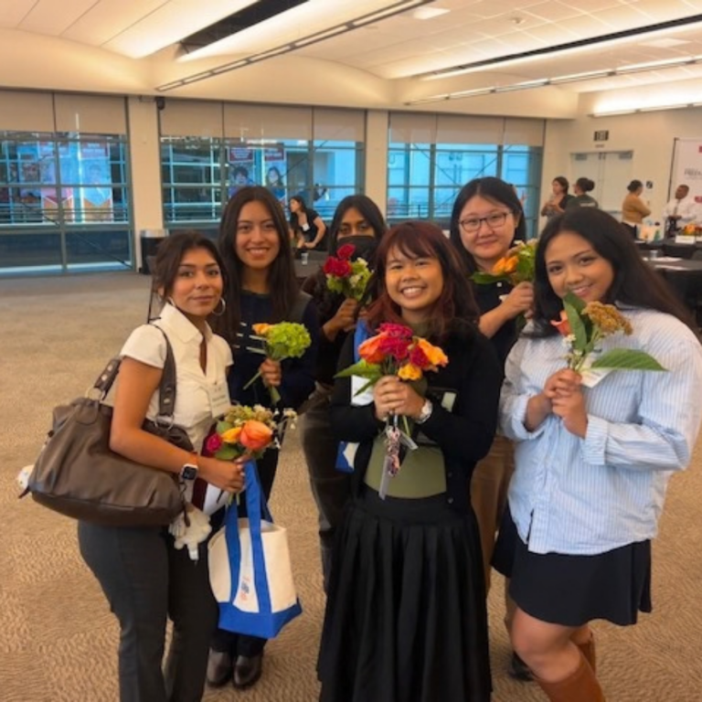 2026 PCC Fellowship Students students posing with flowers
